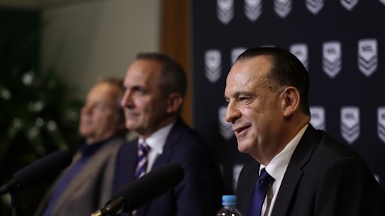 Australian Rugby League Commission Chairman Peter V’Landys, foreground, flanked by outgoing NRL chief executive Andrew Abdo and Nine chief executive Matt Stanton, left.