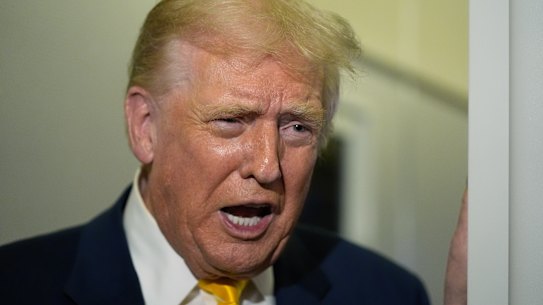 President Donald Trump speaks to reporters on Air Force One on his way to his Mar-a-Lago estate in Palm Beach, Fla., Friday, Nov. 14, 2025. (AP Photo/Manuel Balce Ceneta)