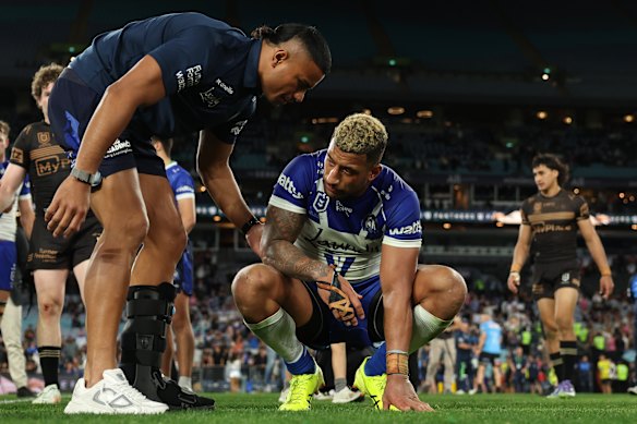 Stephen Crichton consoles Viliame Kikau.