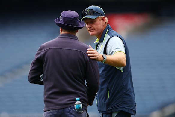 MCG curator Matt Page speaks with Australia coach Andrew McDonald on December 24.