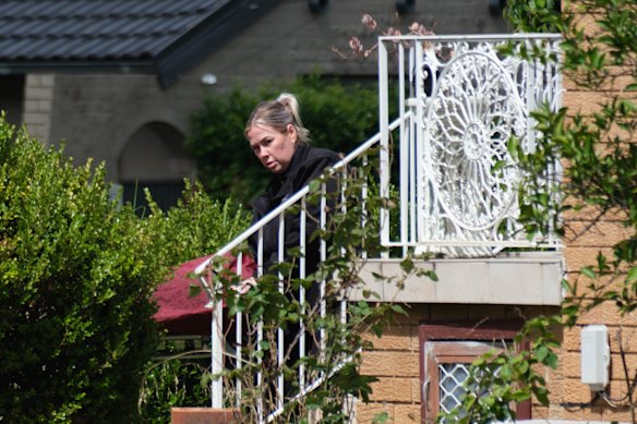 A body is brought out of a house at Quakers Hill, which is now a crime scene.
