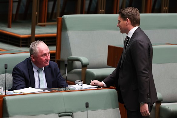 Barnaby Joyce in discussion with Liberal Andrew Hastie during a sitting of Parliament in September.