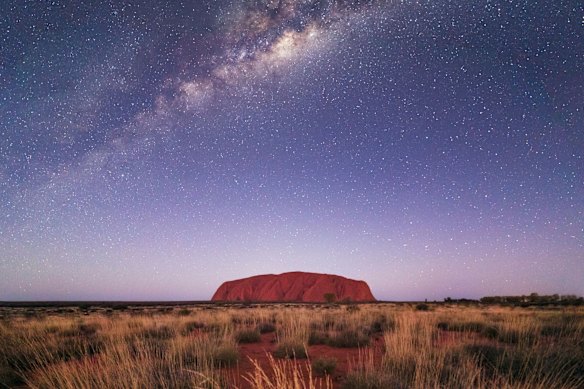 Uluru under the night sky.
