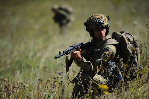 Ukrainian soldiers practise skills near Kharkiv on Tuesday.