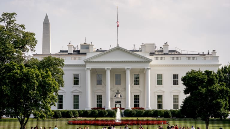 The flag atop the White House flew at half-staff over the weekend but was raised Monday and then lowered again amid criticism.