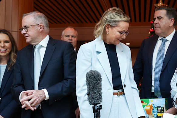 Prime Minister Anthony Albanese and Opposition Leader Sussan Ley, with Speaker Milton Dick (right),  at the launch of the Annual Kmart Wishing Tree Appeal. Two out of three respondents said they’d be cutting back on Christmas spending. 
