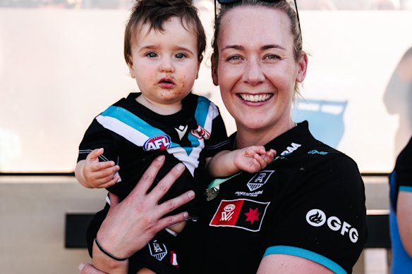 Port Adelaide coach Lauren Arnell and her daughter Marlie.
