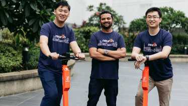 Neuron Mobility co-founders Zachary Wang, left, and Harry Yu, right, with Square Peg partner Tushar Roy. 