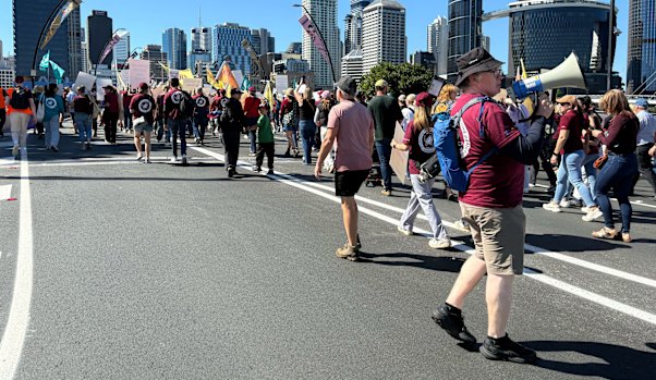 Teachers march across Victoria Bridge.