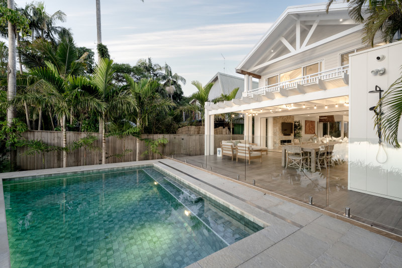 The Bilongil Creek house includes a waterfront residence with a pool, and a three-bedroom cottage behind it.