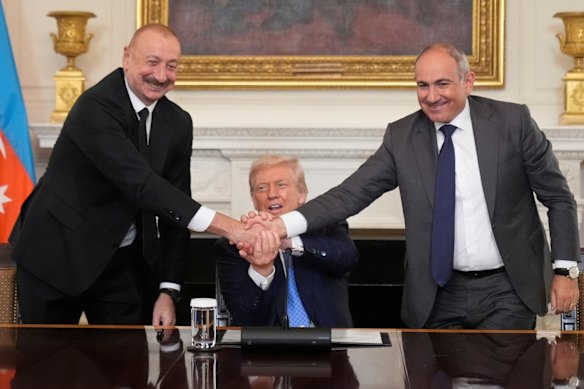 US President Donald Trump shakes hands with Armenian Prime Minister Nikol Pashinyan (right) and Azerbaijan President Ilham Aliyev during a trilateral signing ceremony at the White House this month.
