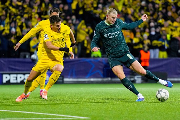Manchester City’s Erling Haaland, right, competes with Glimt’s Jostein Gundersen for the ball as his team topples to an embarrassing loss in the Champions League.