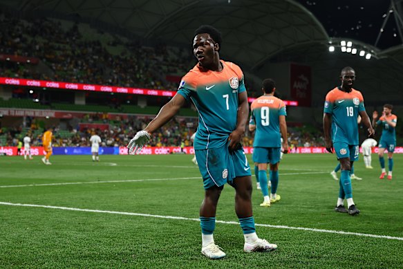 Nestory Irankunda of Australia throws on a silver glove and performs a Michael Jackson dance after scoring on Tuesday night.