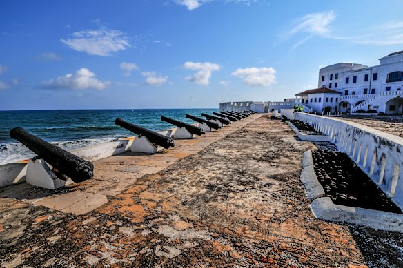 Cannons line the oceanfront below Ghana’s Cape Coast Castle, a fortification used in the trans-Atlantic slave trade.