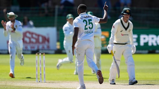 South Africa’s Kagiso Rabada, centre, celebrates the wicket of Australia’s Nic Maddinson, right, on day four.