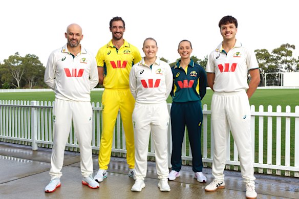 Australian cricketers Nathan Lyon, Mitchell Starc, Alyssa Healy, Ashleigh Gardner, Sam Konstas with new Westpac logo shirts.