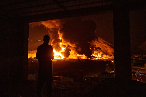 An oil storage facility in Tehran burns after it was hit by Israeli airstrikes.
