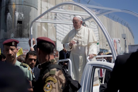A May 2014 photo showing Pope Francis en route to a mass in Manger Square next to the Church of the Nativity, traditionally believed to be the birthplace of Jesus Christ, in the West Bank city of Bethlehem.