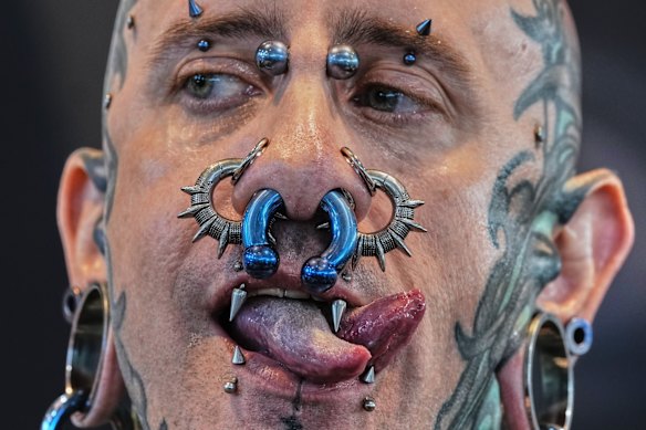 Andrew from Spain shows his split tongue and piercings at the the Gods of Ink Tattoo Convention in Frankfurt