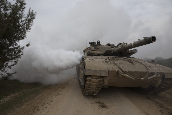 An Israeli tank moves near the border with the Gaza Strip.