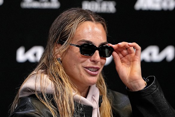 Aryna Sabalenka sports sunglasses at one of many post-match press conferences.