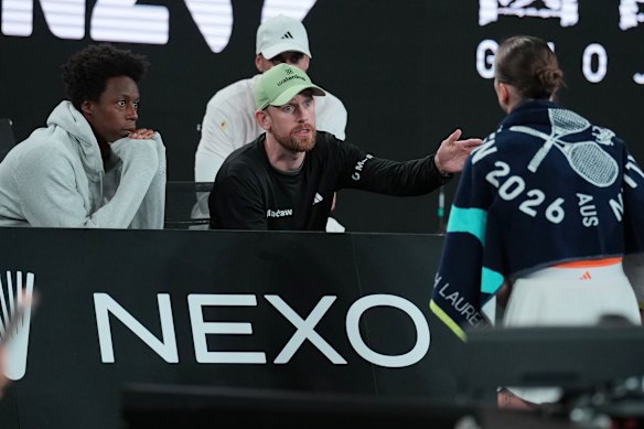 Twelfth seed Elina Svitolina listens as her coach Andrew Bettles and husband Gael Monfils, left, give her advice during her fourth round match against Mirra Andreeva on Sunday. 