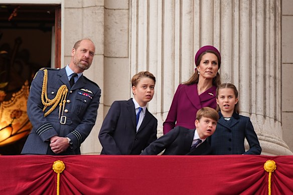 Prince William, Prince George, Kate Princess of Wales, Prince Louis and Princess Charlotte watch a military fly past at Buckingham Palace in May.