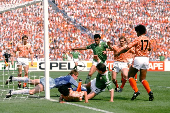 Paul McGrath (centre) stands tall for Ireland against Holland in the 1988 Euros.
