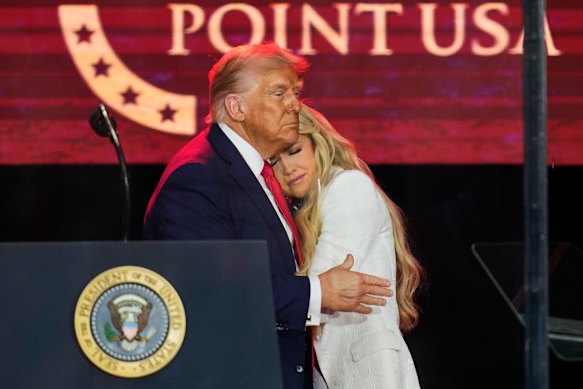 President Donald Trump embraces Erika Kirk at a memorial for conservative activist Charlie Kirk in Arizona on Monday.
