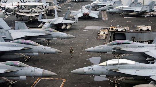 Fighter jets on the flight deck of the USS Abraham Lincoln.