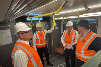 Minister for Transport and Veterans David Elliott, Treasurer and Minister for Energy Matt Kean, Minister for Finance and Employee Relations Damien Tudehope view the New Intercity Fleet, at Kangy Angy Maintenance Centre on Friday.