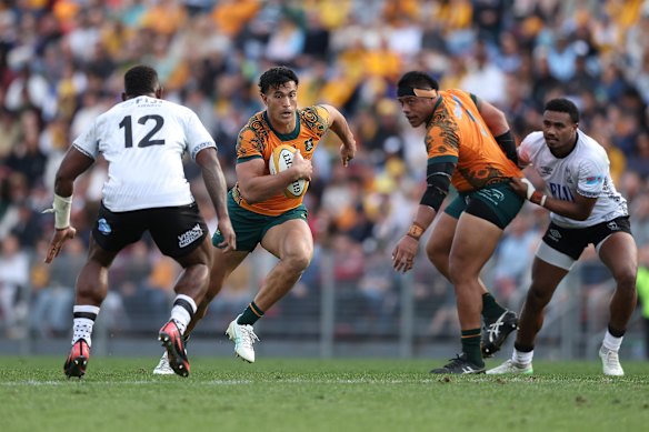 Joseph-Aukuso Suaalii of the Wallabies runs with the ball