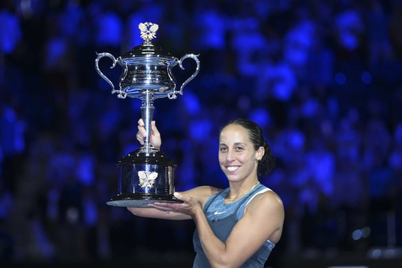Australian Open champion Madison Keys holds up the trophy.