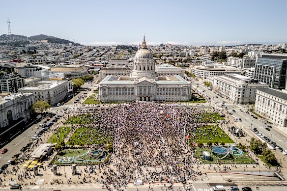 Demonstrators gather in Civic Center Plaza in San Francisco.