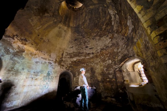 Boom with a view: NPWS Ranger Sam Woodrow at the Beehive casemates at Georges head where heavy guns were positioned. 