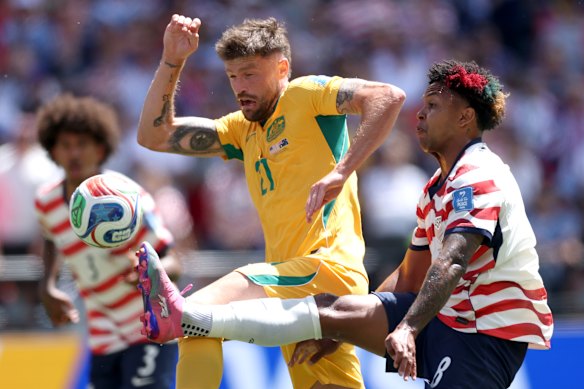 Cameron Burgess takes on USA’s Weston McKennie.