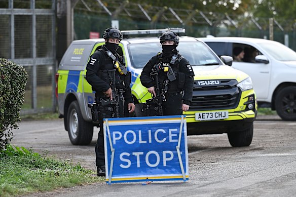 Armed police maintain road blocks and security checks around RAF Fairford on Monday.