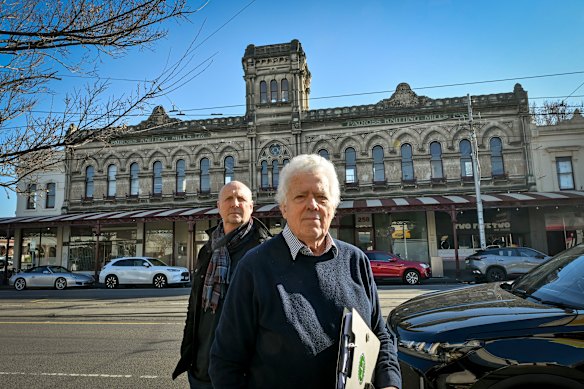 Alan Nightingale (left) and Mitchell Dowd of the Emerald Hill Residents Association in front of the Patross Knitting Mills building, which is opposite a site of a new development.