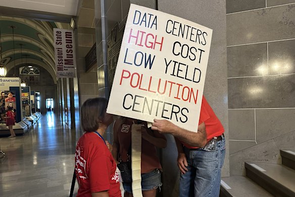 Opposition to data centres is rising across the United States. Here, a protester prepares to join a rally at the Missouri Capitol in Jefferson City.
