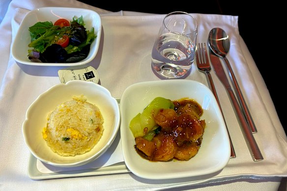 The stir-fried seafood with fried rice is cooked to perfection.