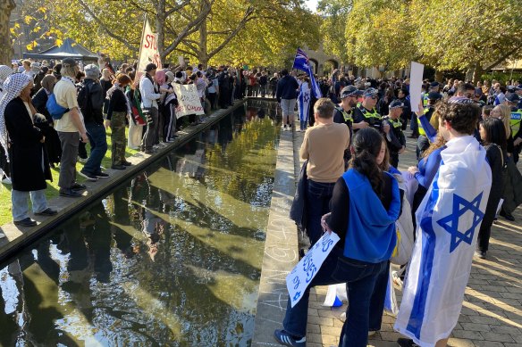 Members of a Jewish rally against antisemitism at the University of Melbourne look   disconnected  with the pro-Palestine pupil  camp.