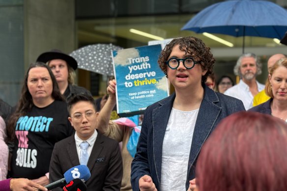 Trans advocates and supporters addressed media outside Brisbane’s Supreme Court after a judge ruled the government’s ban on gender-services in January was unlawful. 