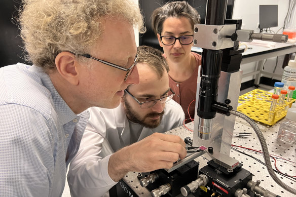 Technology tamfitronics Professor Warwick Bowen, Dr Igor Marinkovic, and Dr Pavlina Naydenova in the laboratory.