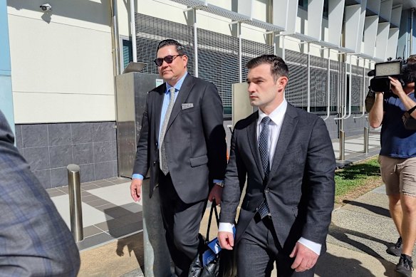 Ryan Bayldon-Lumsden (right) walks next to his legal team outside Southport Courthouse.