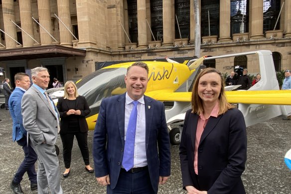 Lord Mayor Adrian Schrinner and Wisk regional director Catherine MacGowan with a fifth generation self-flying air taxi the company hopes to have flying over Brisbane before the 2032 Games.