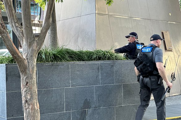 Police sweeping King George Square ahead of the event.