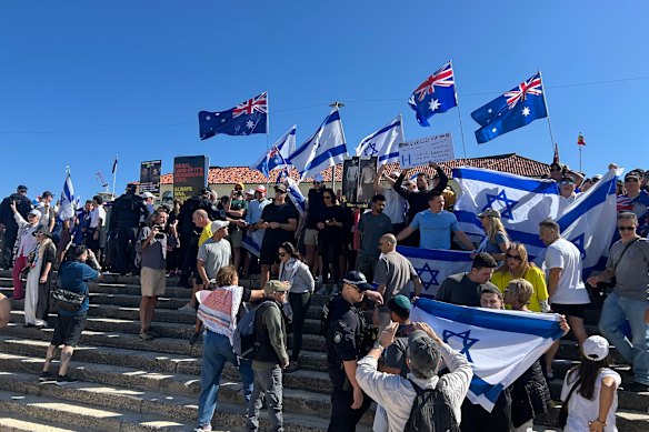 Israeli and Australian flags are flown protesting a pro-Palestine event at Bondi Beach.
