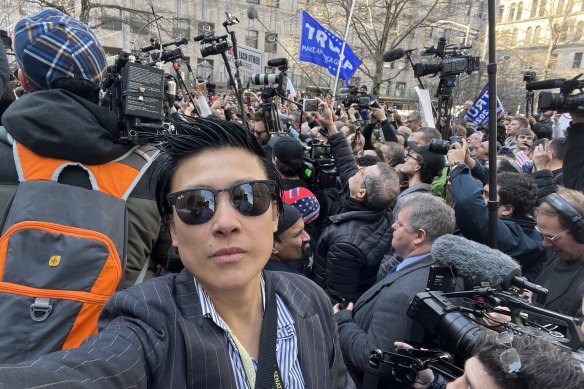Farrah Tomazin stands in front of the crowd outside the Manhattan courtroom where Donald Trump’s hush money trial was held.