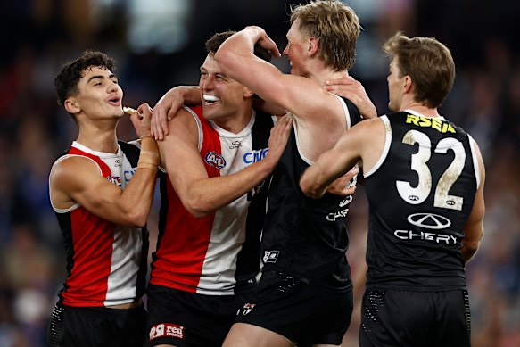 Saints Hugo Garcia, Rowan Marshall, Max Heath and Mason Wood celebrate a goal.