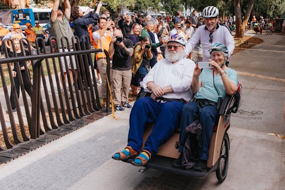 The first cyclists ride over the new 170-metre-long ramp on Tuesday, shortly after a ribbon cutting.